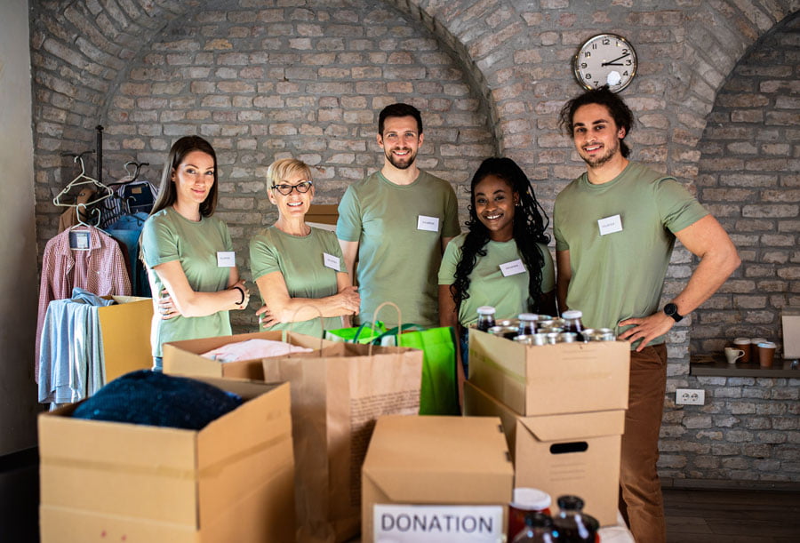 Volunteers working in a charity donation centre.